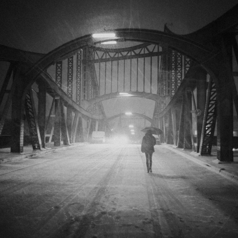 Shooting on a snowy night on a bridge in Berlin