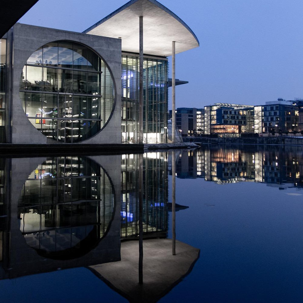 Building reflecting on the river in the evening