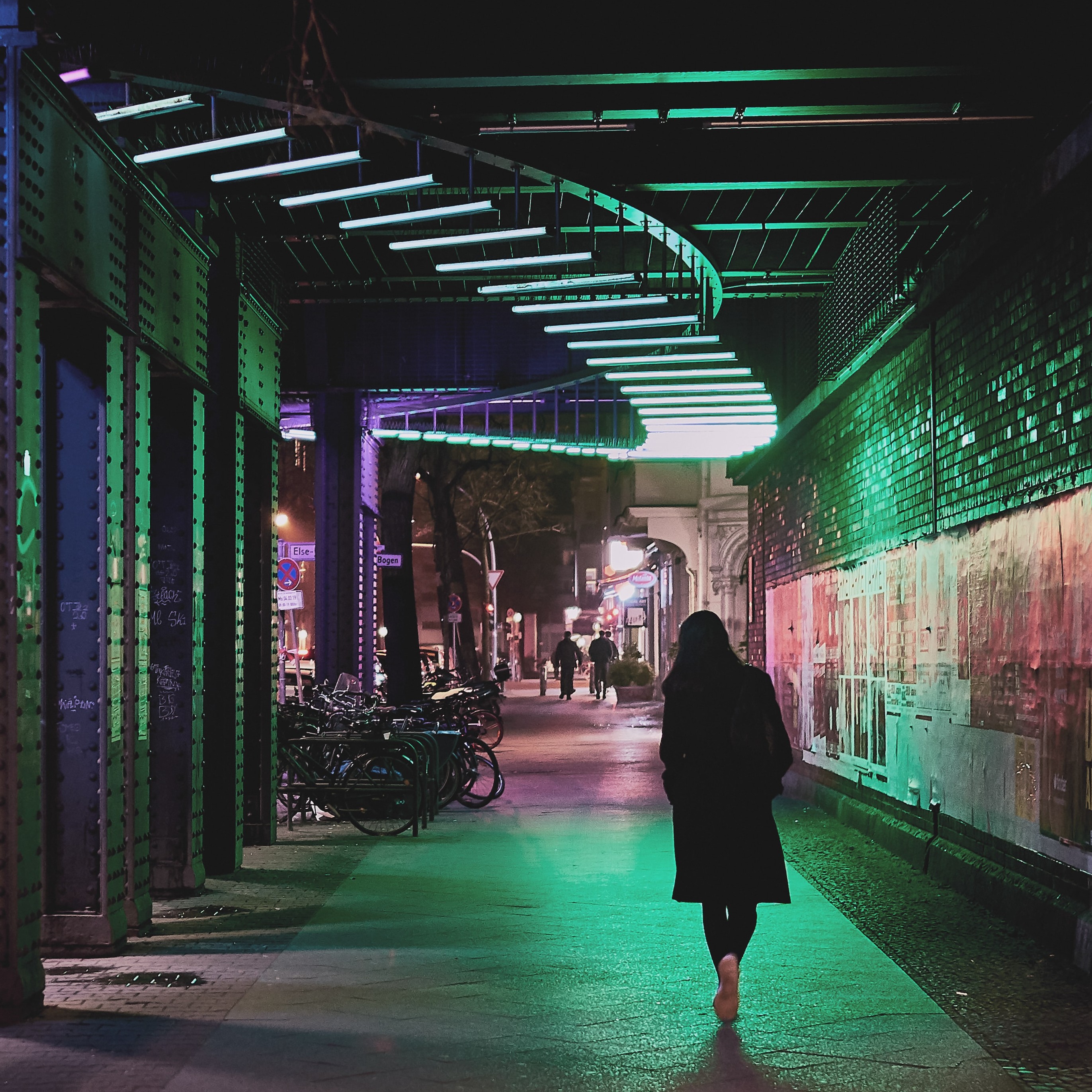 woman photographed walking alone in the streets at night